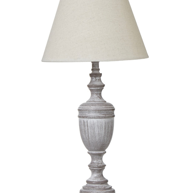 Weathered grey wooden lamp by Hill Interiors, showcasing a rustic lighting fixture with a textured wooden base.