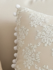 Cream neutral lace bow cushion from Starlight Express, soft furnishings with delicate lace details and a plush, comfortable design.