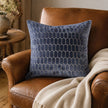 Navy Blue Velvet Honeycomb Print Cushion Cover, navy honeycomb-patterned cushion on a brown leather chair