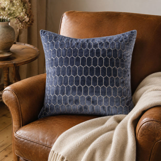 Navy Blue Velvet Honeycomb Print Cushion Cover, navy honeycomb-patterned cushion on a brown leather chair