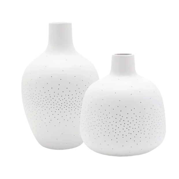 White Ceramic Loire Bottle LED Table Lamp, two unlit white perforated bottle lights against white
