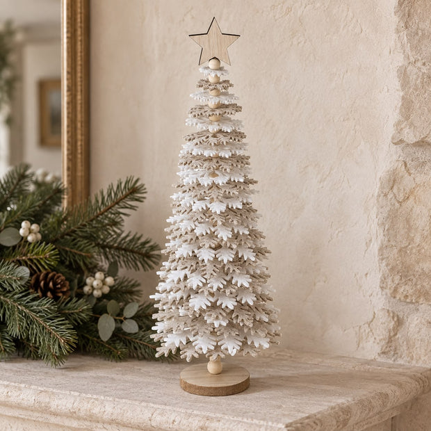 Beige And White Felt Snowflake Tree, layered felt tree beside greenery on a stone mantel