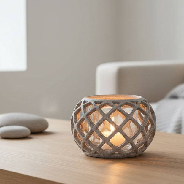 Large round ceramic lattice hurricane lantern, home decor by Hill Interiors, featuring intricate cutout pattern and a spacious opening for candles.
