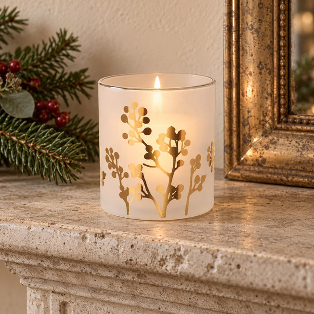 White and Gold Glass Tealight Holder, white glass holder with gold foliage glowing on a mantel
