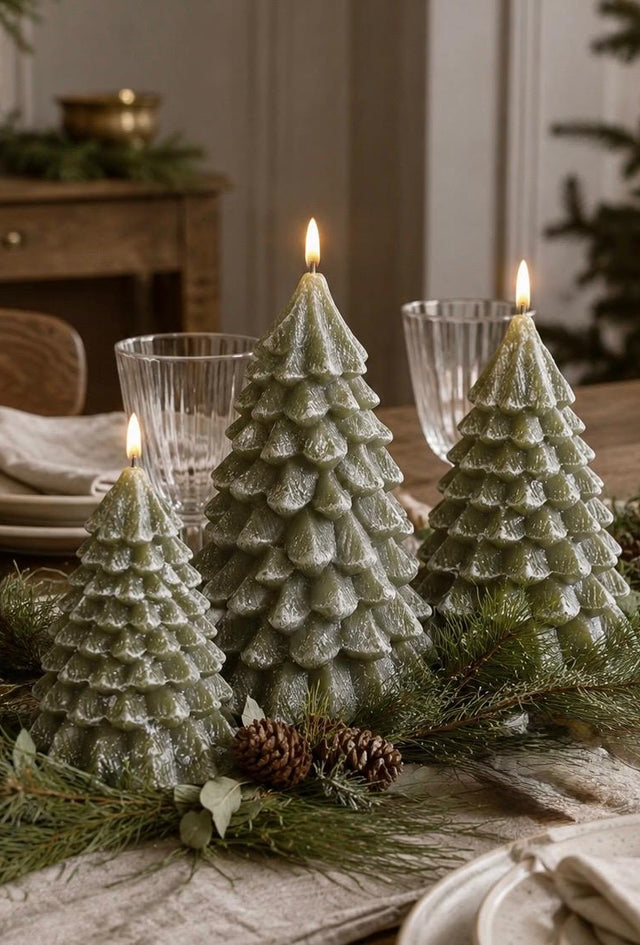 LED Light Up Green Christmas Tree Candle, grouped green tree candles with glowing tips on a festive dining table
