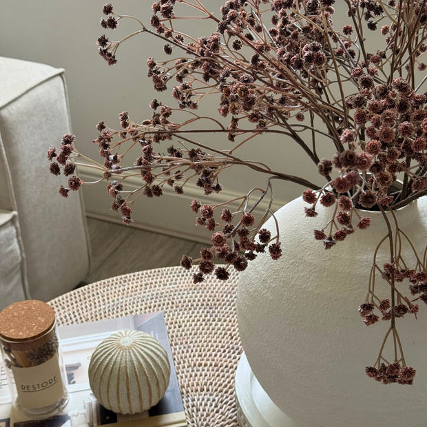 Artificial Brown Neutral Gypsophila Stem, close view of brown stems above a woven coffee table