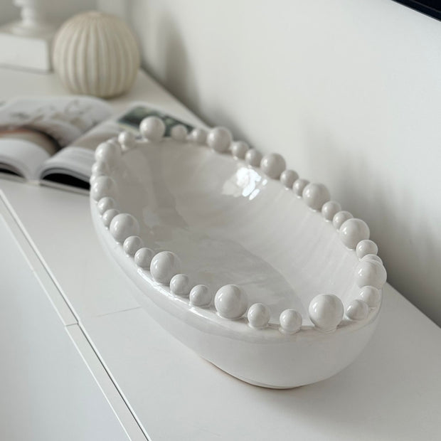 Oval Extra Large White Bobble Bowl, large oval white bobble-rim bowl on a console