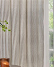 Black and white striped blackout eyelet curtains from Riva Home, soft furnishings for stylish window coverage.