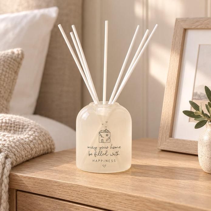 Beige Moments clear glass reed diffuser from Widdop & Co, a home fragrance with reed sticks for scent diffusion.