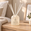Beige Moments clear glass reed diffuser from Widdop & Co, a home fragrance with reed sticks for scent diffusion.