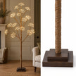 Lightstyle London LED Woodland Christmas tree decorated with lights, featuring natural woodland-inspired design and festive lighting.