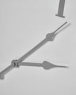 White round Aubrey wall clock by Hill Interiors showing a minimalist design with black hour and minute hands.
