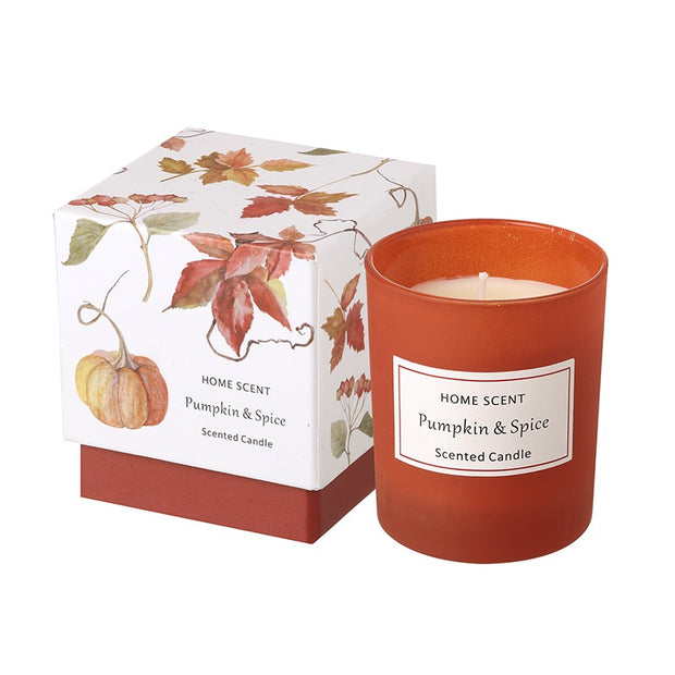 Boxed Pumpkin And Spice Candle, orange candle and patterned gift box against white