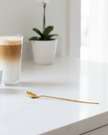 Gold flower long latte spoon by Starlight Express with a detailed floral design and elegant long handle.