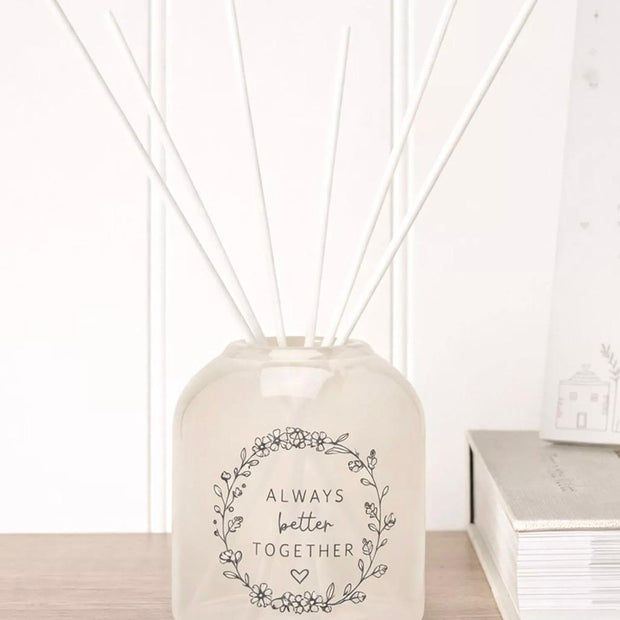 Beige Moments Clear Glass Reed Diffuser - Always Better Together, Always Better Together diffuser beside books