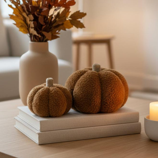 Brown Faux Fur Pumpkin, two brown faux fur pumpkins on stacked books