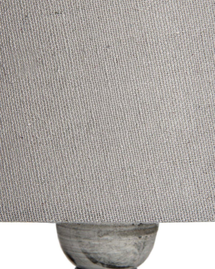 Hill Interiors Uthina Wooden Table Lamp with a sleek design, featuring a wooden base and fabric shade for modern lighting.