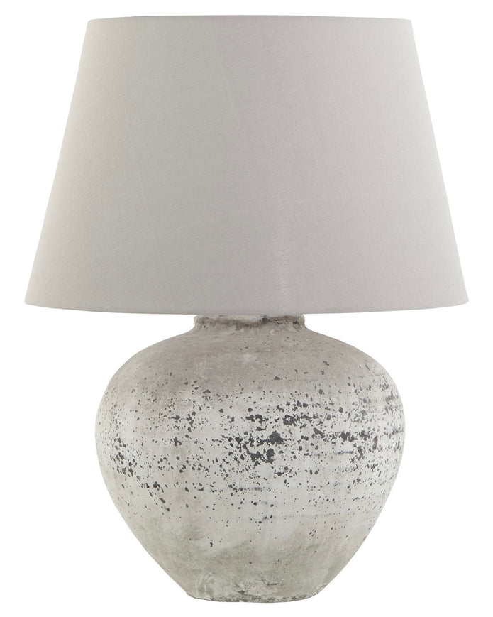 Large ribbed stone table lamp from Hill Interiors with a textured, natural finish suitable for modern lighting decor.