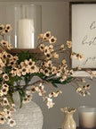 Artificial peach daisy flower stem from Starlight Express, featuring realistic blooms and greenery for home decor.