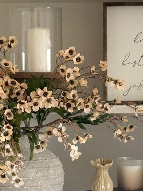Artificial peach daisy flower stem from Starlight Express, featuring realistic blooms and greenery for home decor.
