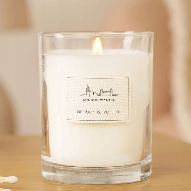 London Wax Company Lidded Candle - Amber & Vanilla, lit Amber and Vanilla candle in a clear jar