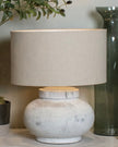 Hill Interiors Darcy squat round stone lamp with textured surface and modern lighting design.