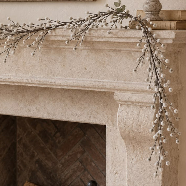 Snowy Twig Garland, snowy twig garland draped across a stone mantel