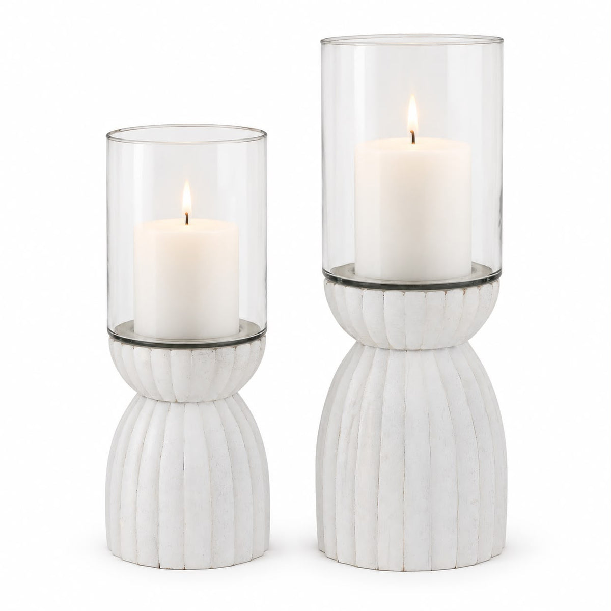 White Carved Hurricane Lantern, two white carved bases with clear glass candle sleeves against white
