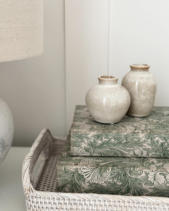 Set of two vintage cream and green Coach House storage book boxes with decorative design, ideal for home decor and organization.