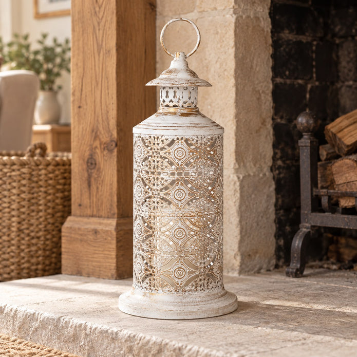 Tall white metal cut out lantern, decorative gift from Heaven Sends with intricate openwork design for stylish lighting.
