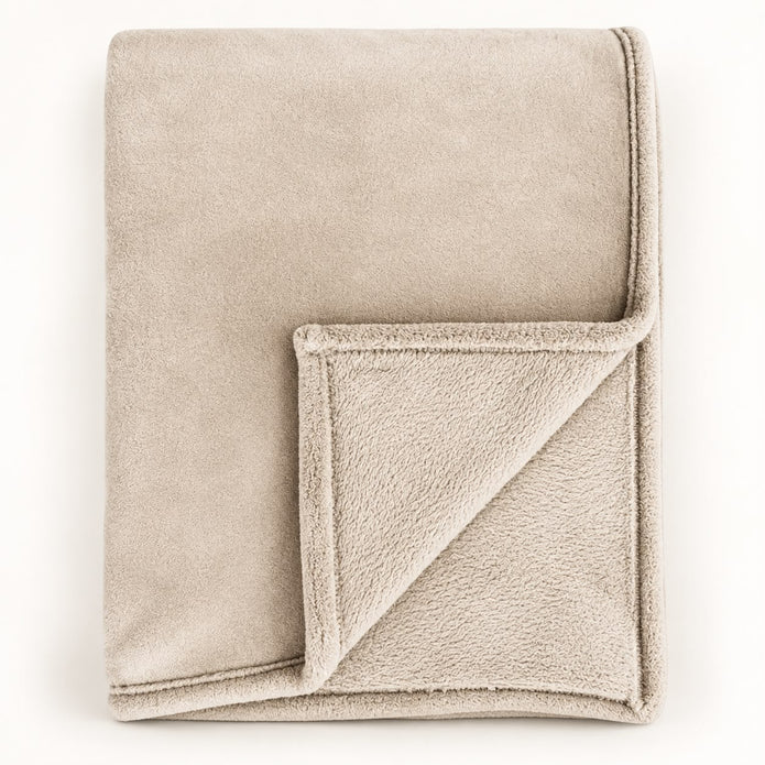 Cream Luxury Snuggle Blanket Throw, folded cream throw with its corner turned back on white