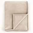 Cream Luxury Snuggle Blanket Throw, folded cream throw with its corner turned back on white