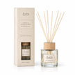 London Wax Company Reed Diffuser in Fig and Blackcurrant scent, elegant glass bottle with reed sticks for home fragrance.