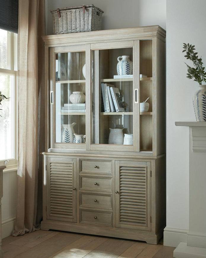 Delphine Collection sliding glass dresser top by Hill Interiors, modern furniture piece with clear glass surface and sleek design.