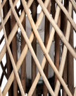 Natural rattan wicker bulbous garden candle lantern for home decor, featuring a woven design and glass interior holder.