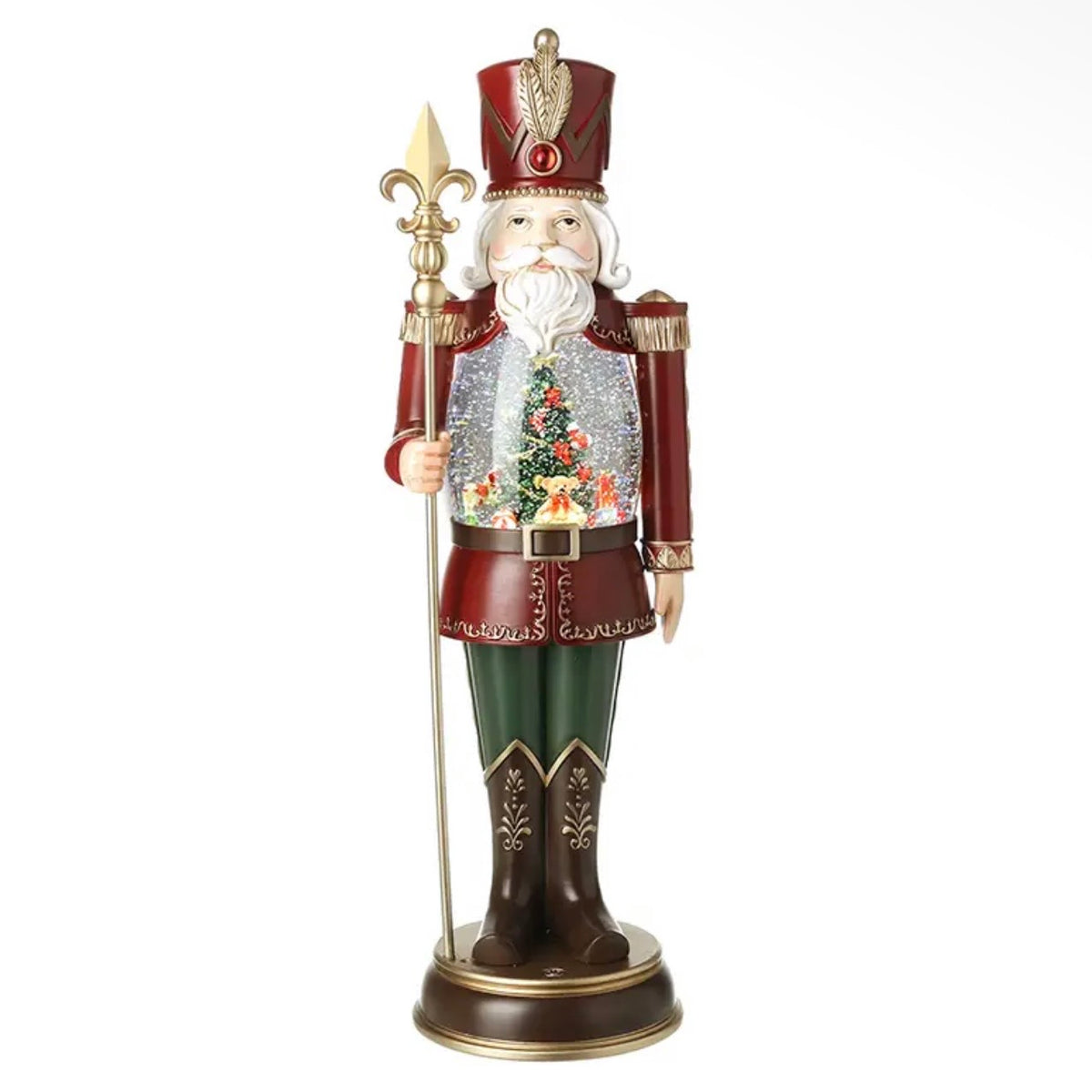 Red and gold nutcracker LED snow globe with Christmas tree scene, green trousers and gold sceptre