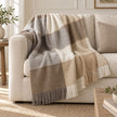 Cream Blanket Stitch Check Blanket Throw, cream, beige and grey checked throw draped over a sofa