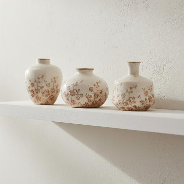 Small White Jug Vase With Autumnal Floral Pattern, three small white vases with autumn floral patterns on a shelf