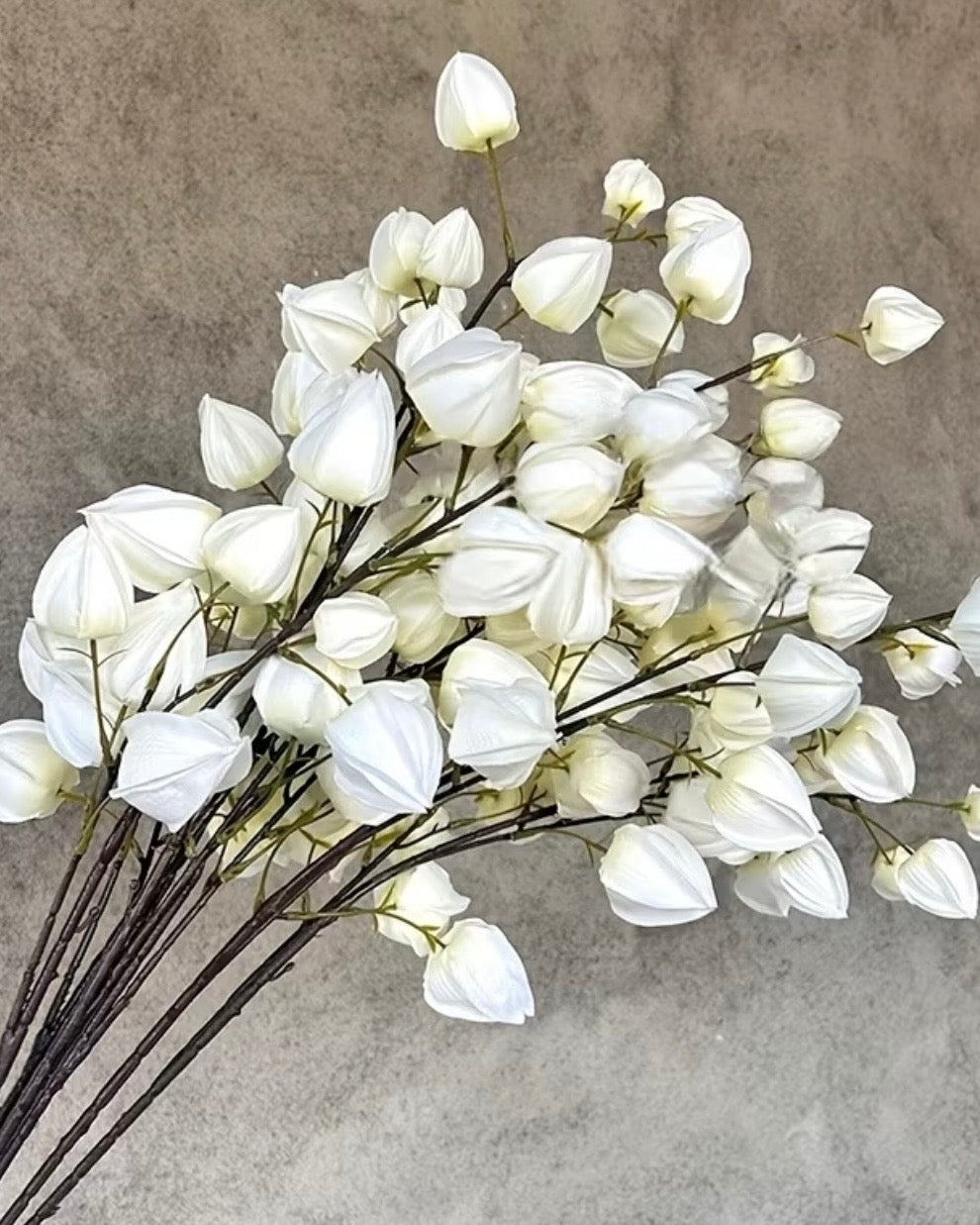 Artificial white lantern stem from Starlight Express, featuring realistic white lantern-shaped foliage for decorative use.