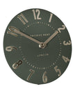 Olive green Thomas Kent 6-inch Mulberry mantle clock with black hands and white dial, mounted on a wooden surface.