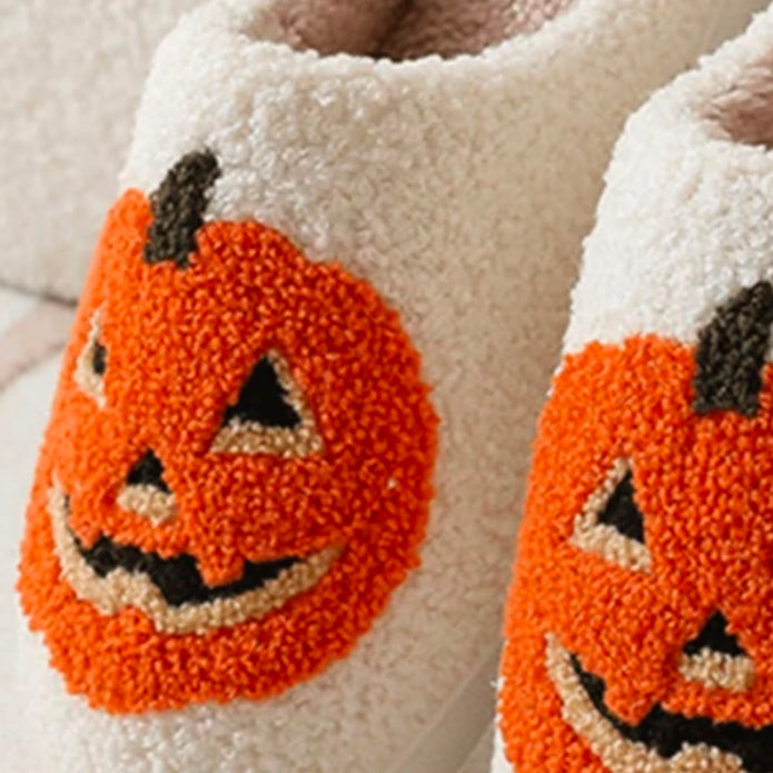 Pumpkin Slippers, close-up of the orange pumpkin embroidery on cream fleece