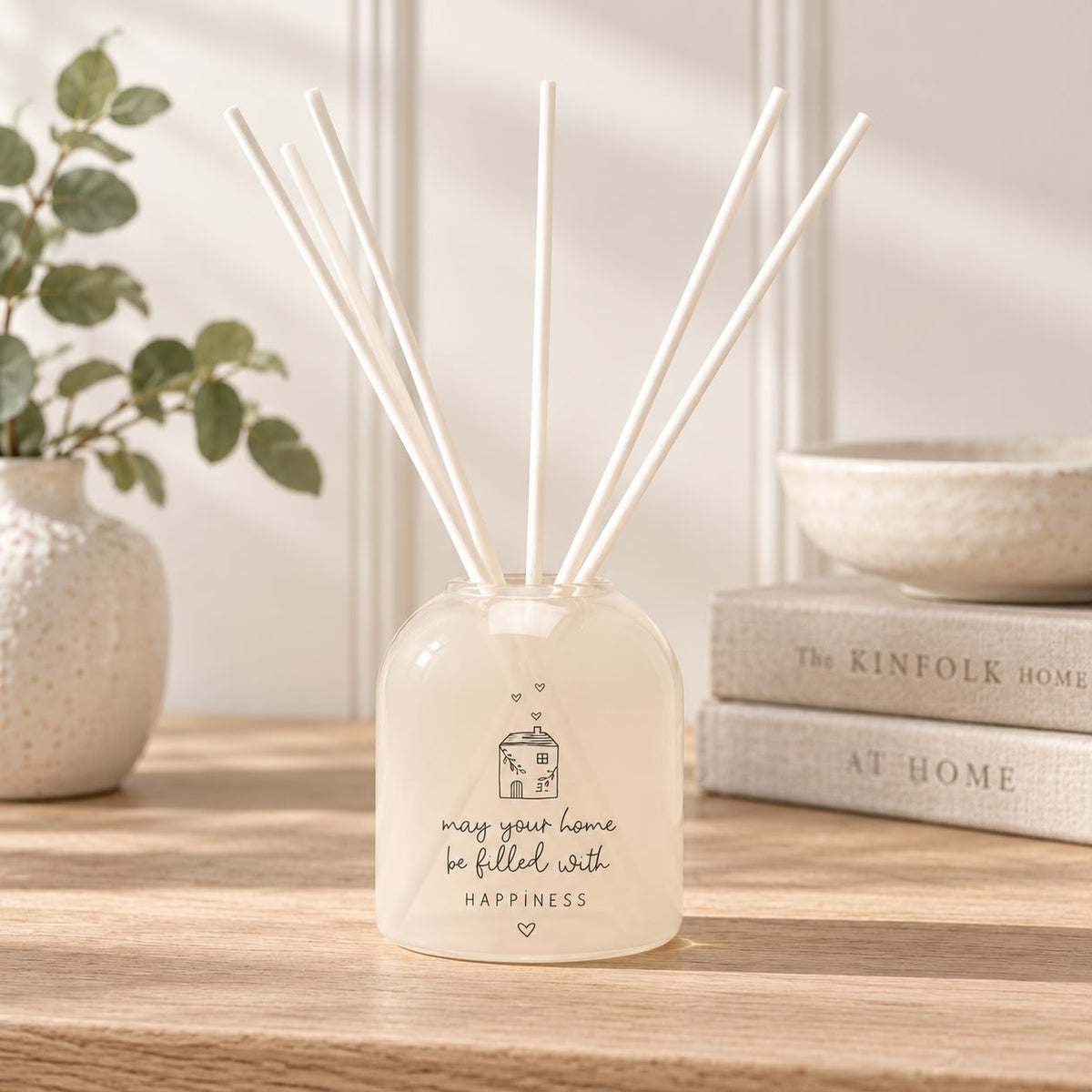 Beige Moments clear glass reed diffuser by Widdop & Co, showing a sleek, minimalist home fragrance bottle with reed sticks.