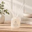 Beige Moments clear glass reed diffuser by Widdop & Co, showing a sleek, minimalist home fragrance bottle with reed sticks.