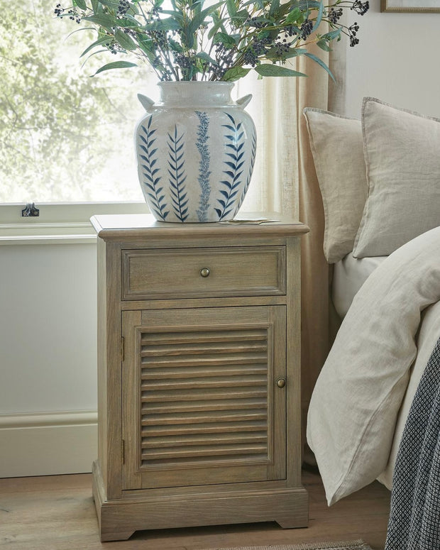 Hill Interiors Delphine Collection bedside table with one drawer and one door, featuring a left-hand design and modern furniture style.