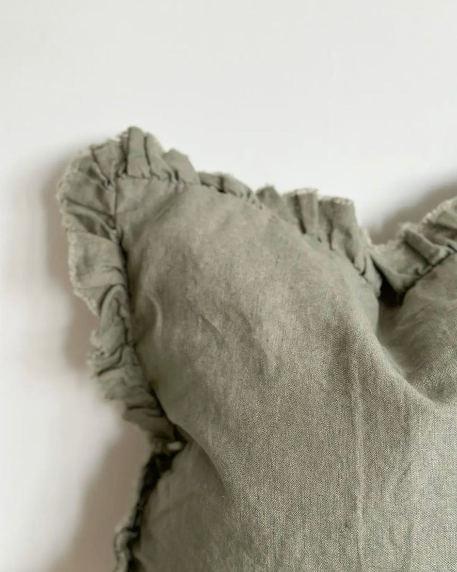 Olive green square linen cushion cover with ruffled edges from Ellenvale Trade, soft furnishings, full view of the stylish cover.