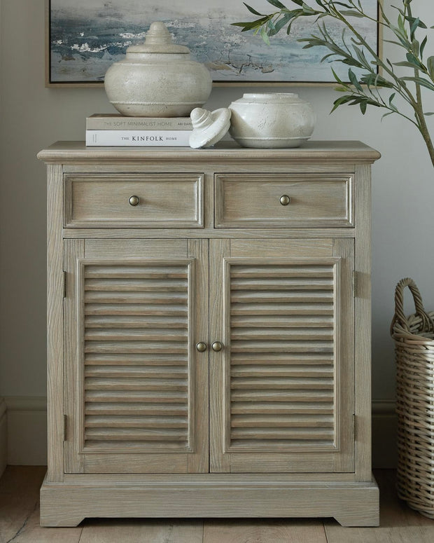 Delphine Collection Hill Interiors 2-drawer, 2-door chest with a sleek wood finish, featuring modern furniture design and clean lines.