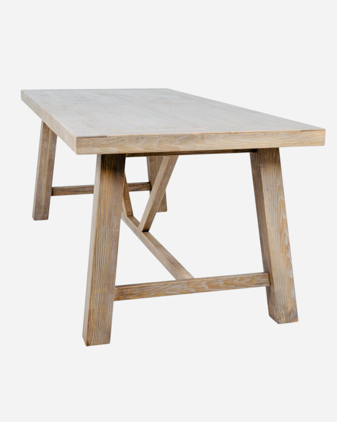 Large Haldon Collection dining table by Hill Interiors, showcasing a spacious wooden surface in a modern dining room setting.
