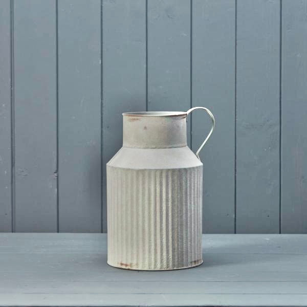 Satchville ribbed metal vase with a sleek, cylindrical design, featuring textured vertical ribs for a modern decorative look.