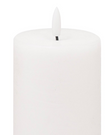 White LED Light Up Pillar Candle from Hill Interiors, showing a glowing, flickering candle with a realistic wax finish and textured surface.