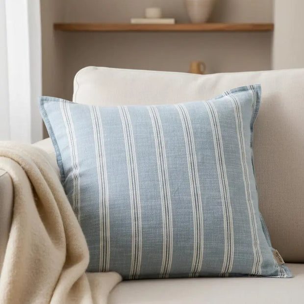 Ocean blue Abersoch stripe cotton cushion cover by Riva Home, featuring soft furnishings design with vibrant blue and white stripes.